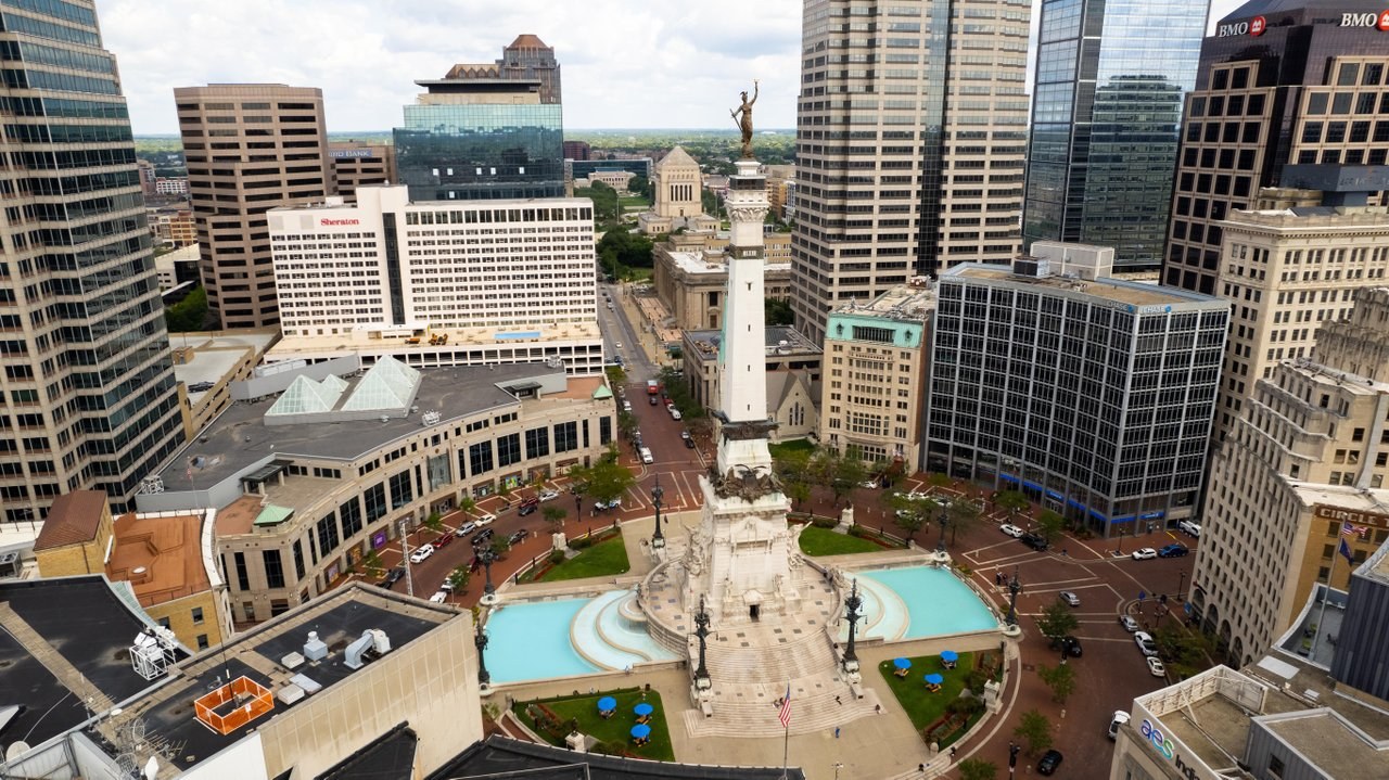 An aerial view of the Soldiers and Sailors Monument and the buildings surrounding Monument Circle.